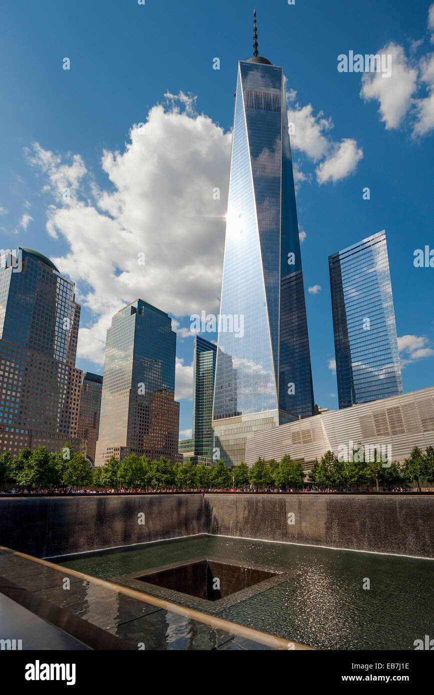 The New World Trade Center stands over the 9/11 Memorial in New York City Stock Photo