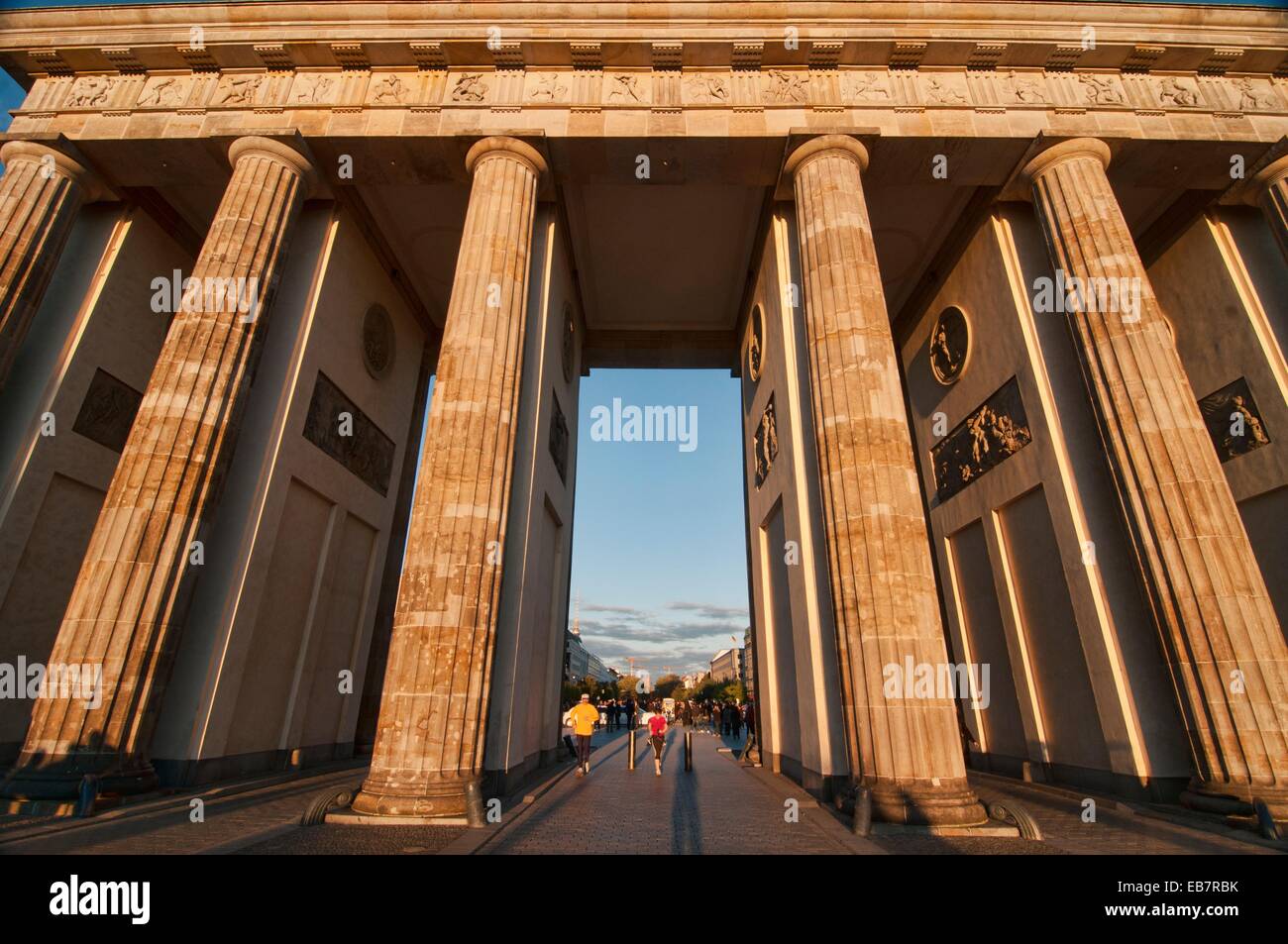 The Brandenburg Gate, landmark and icon of Berlin, lit up at sunset ...