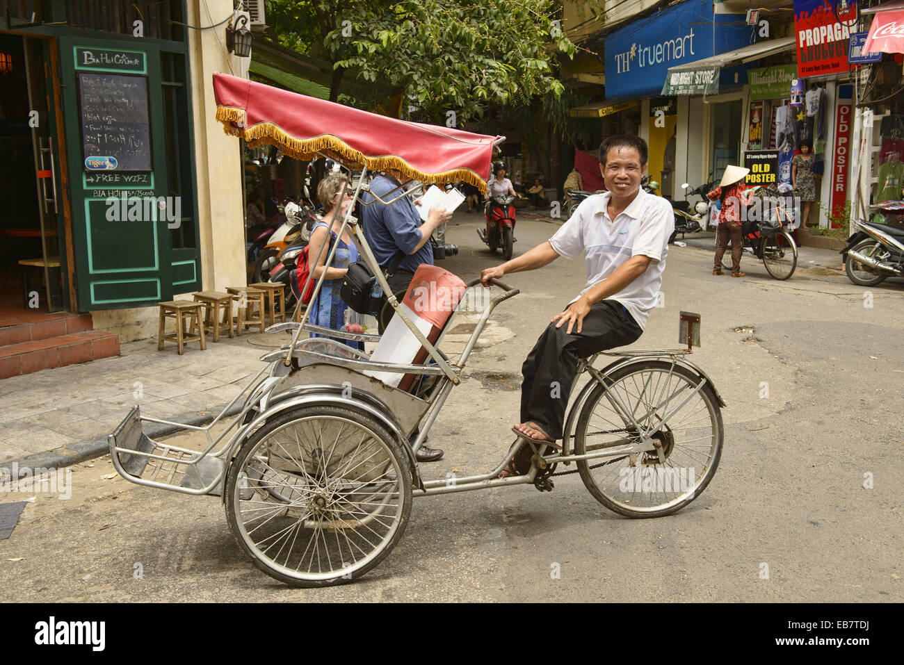 Cyclo driver in Hanoi, Vietnam Stock Photo - Alamy