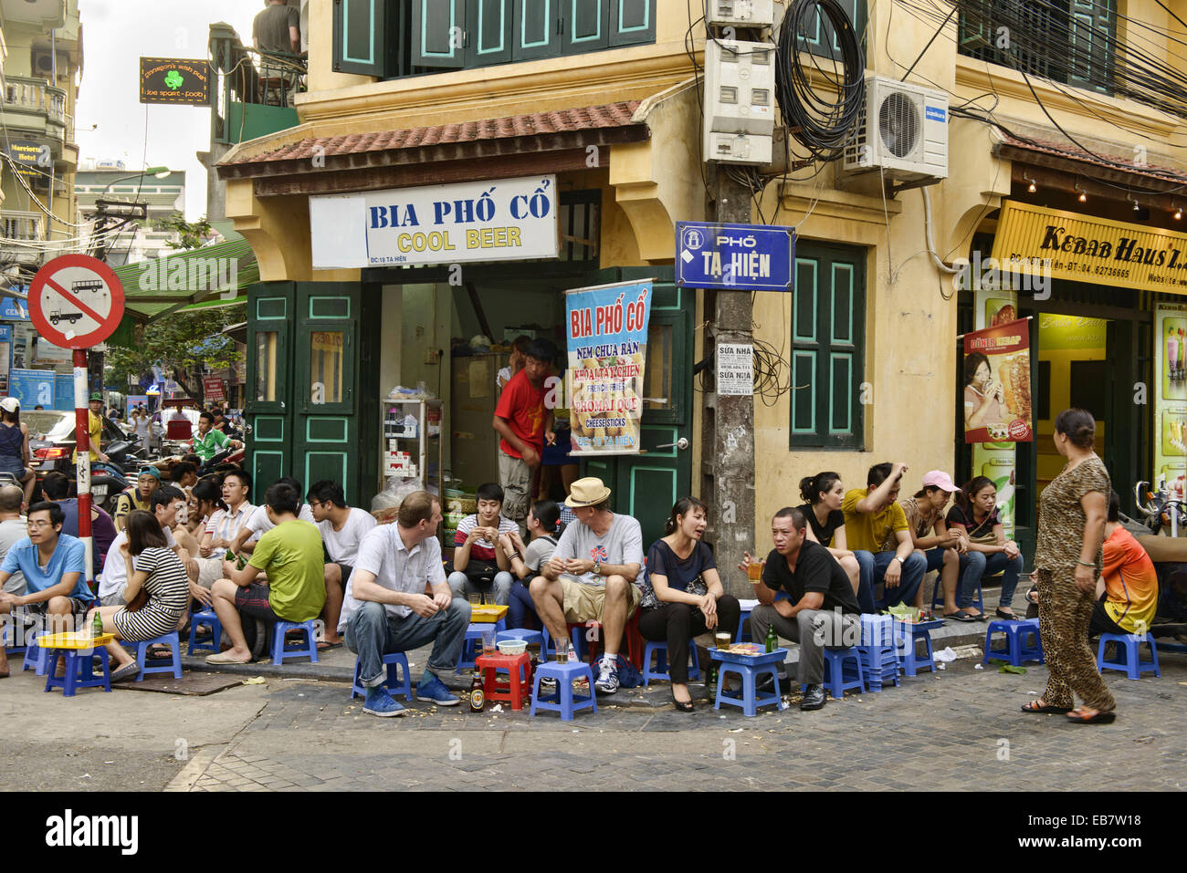 enjoying draft beer on the Bia Hoi Corner in Hanoi, Vietnam Stock Photo Alamy