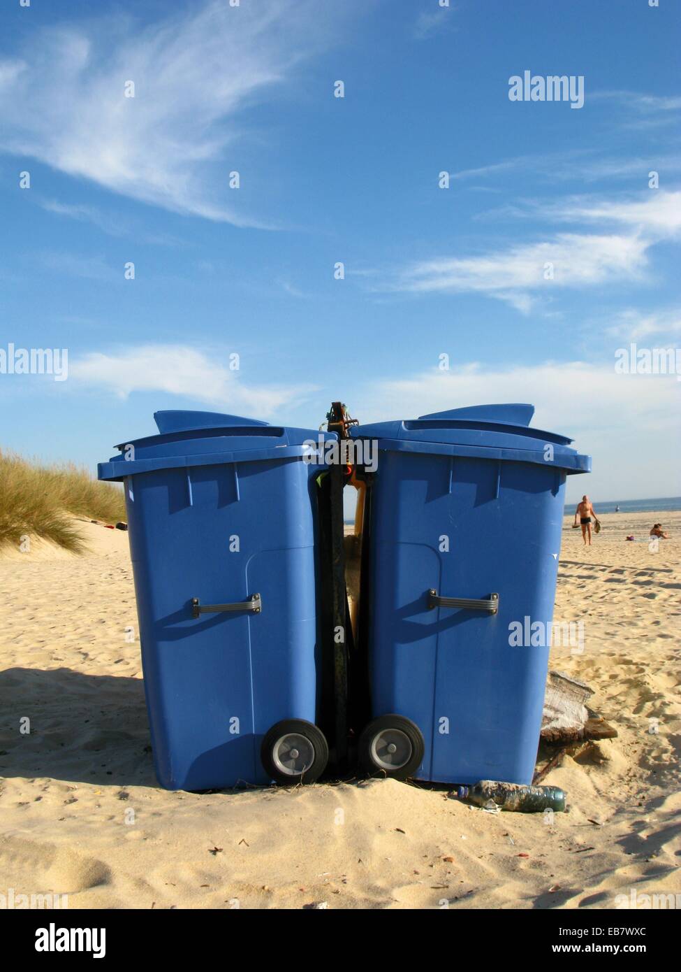 two blue trash containers with wheels on a beach, Andalucia, Spain