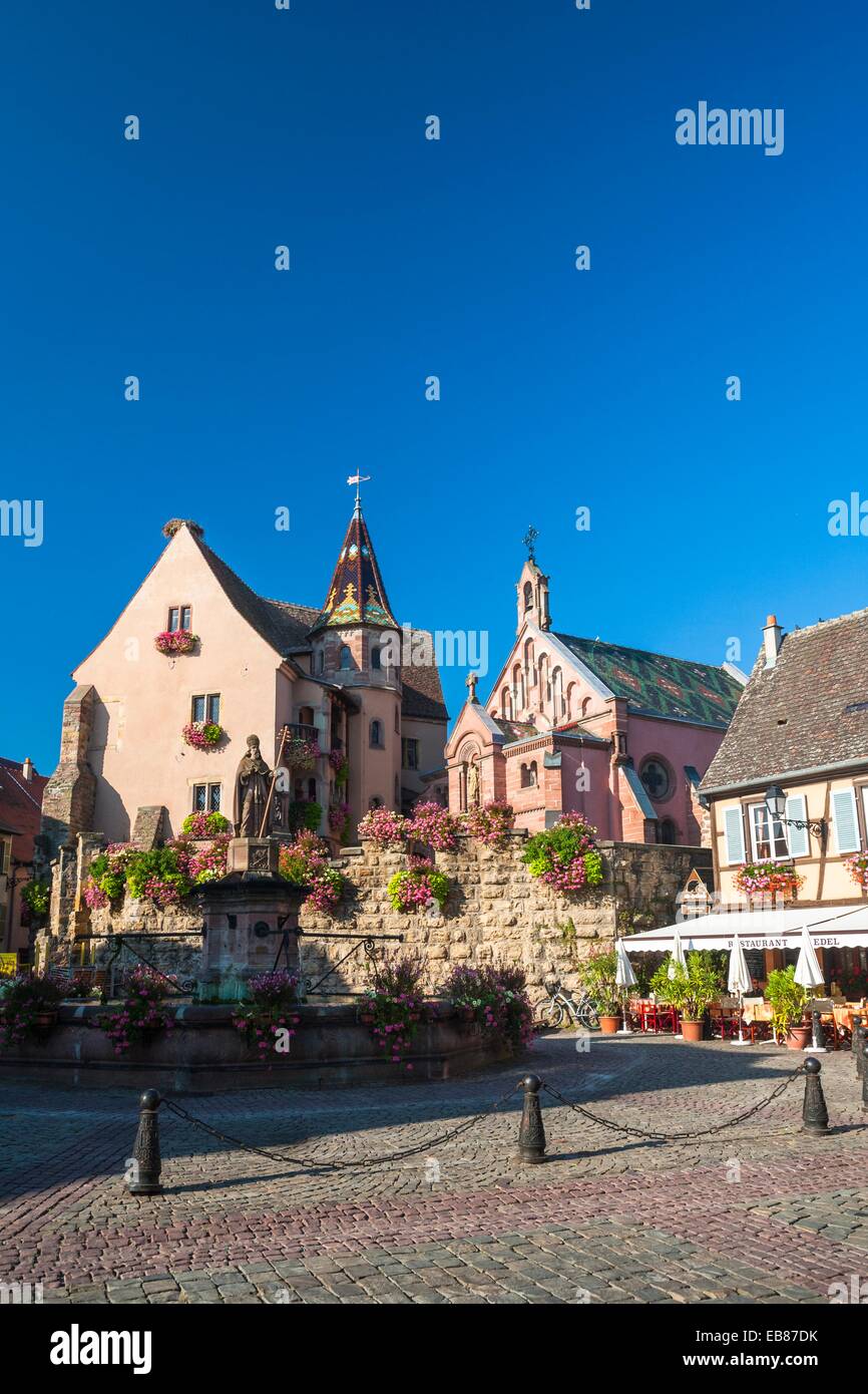 Market square and picturesque houses in Eguisheim, Alsace, France