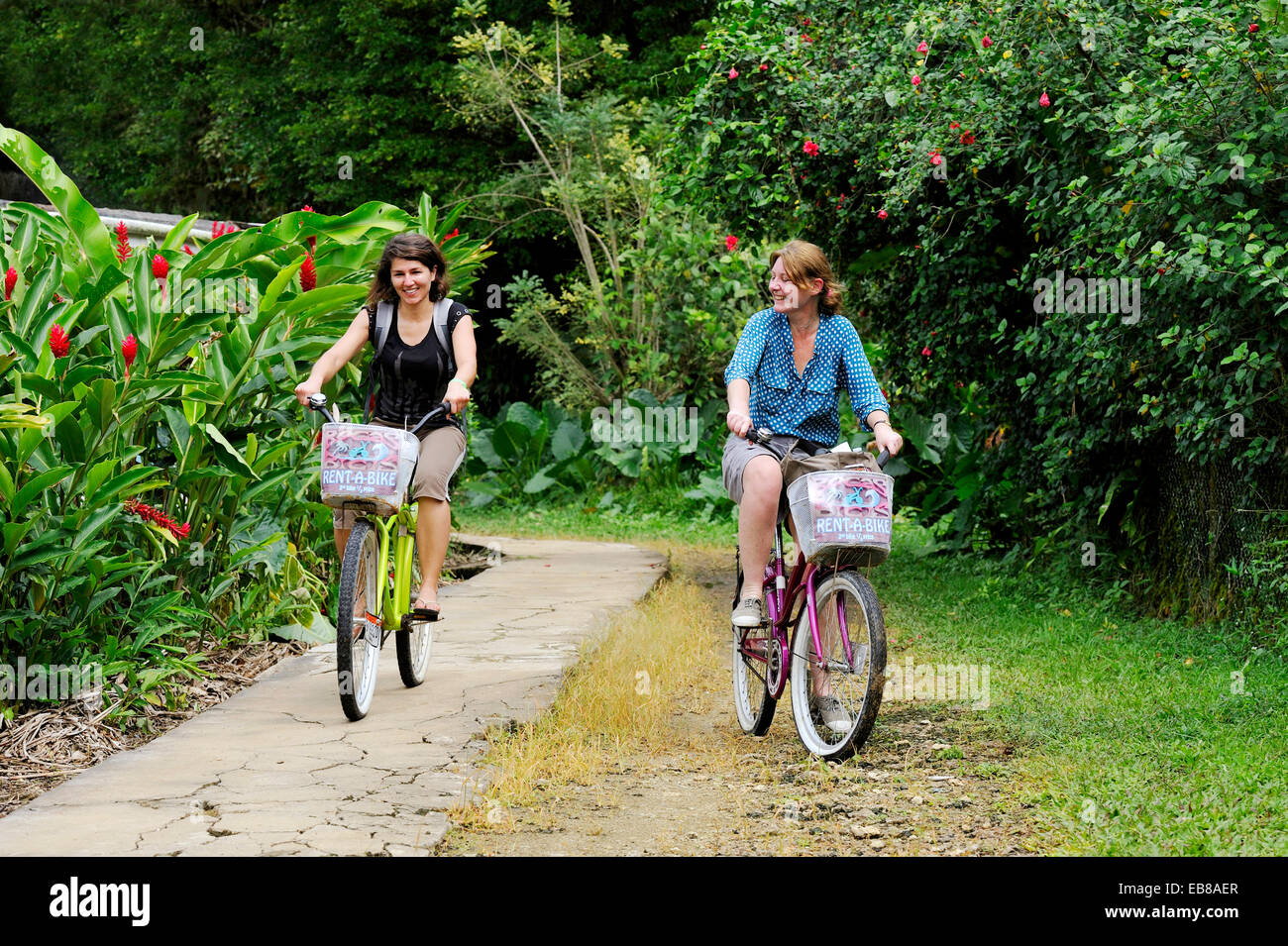 young women going for bike ride at Colon Island, Bocas del Toro
