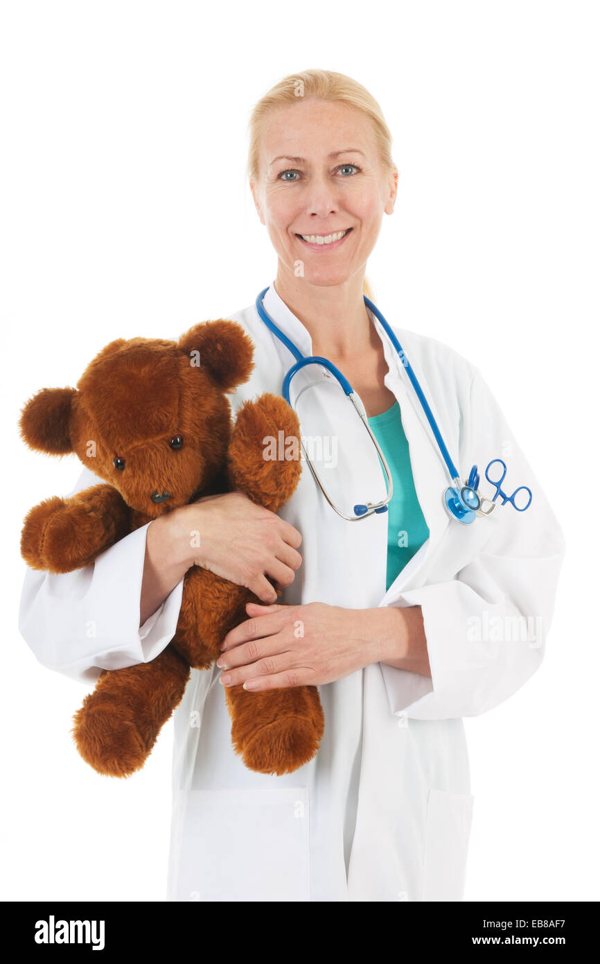 pediatrician listening to heartbeat from stuffed bear Stock Photo