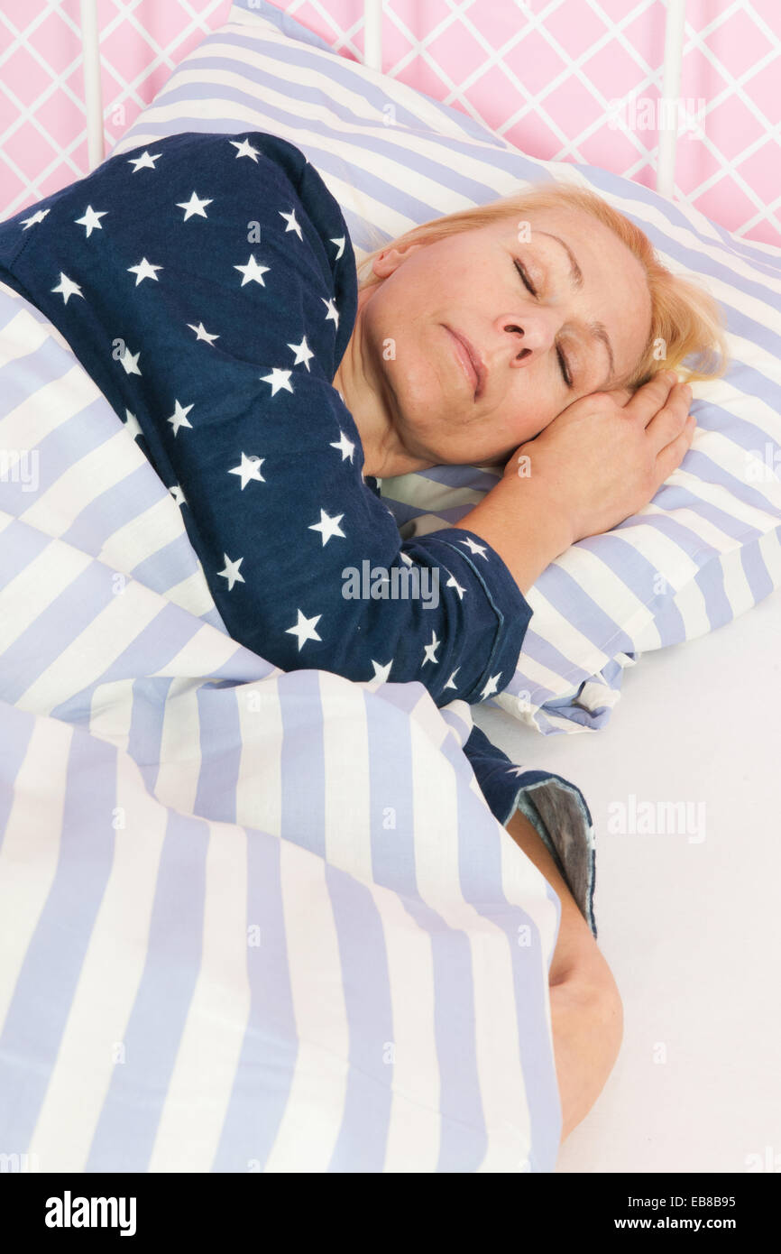 Mature woman sleeping bed hi-res stock photography and images - Alamy