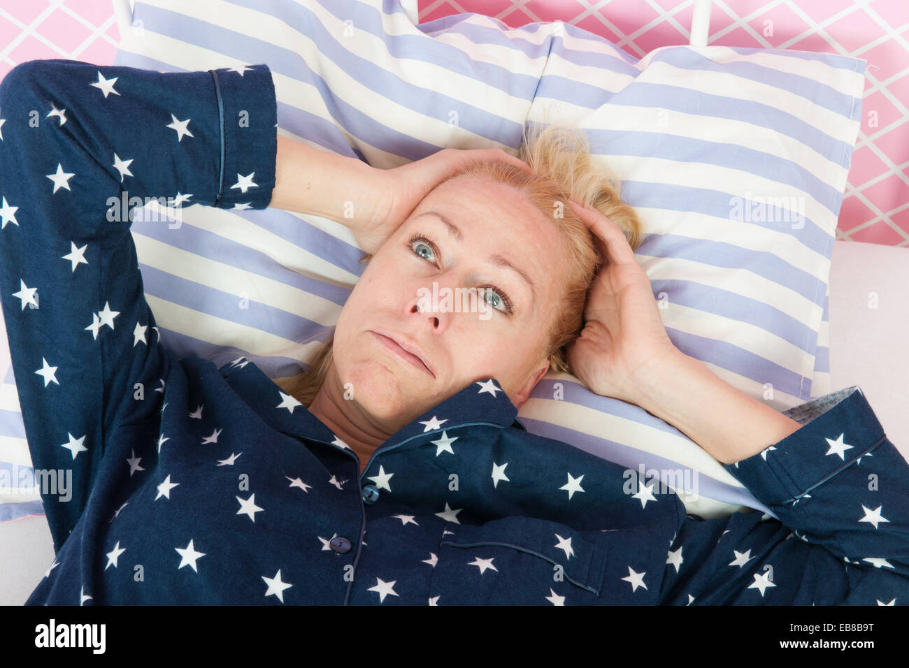 Blond woman of mature age with insomnia Stock Photo