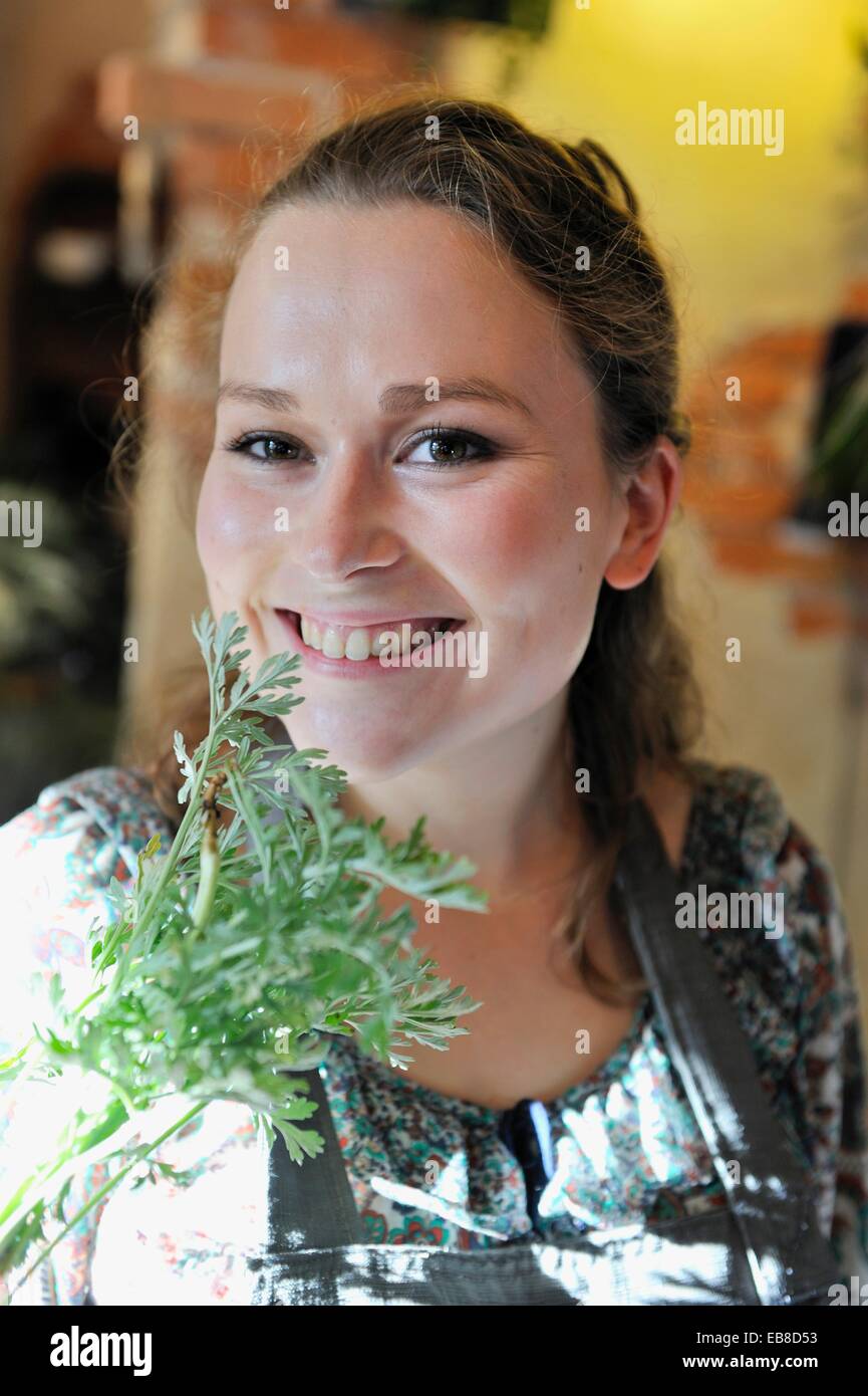 Florist Holding Some Absinthe Leaves Le Jardin De Juliette Stock Photo Alamy