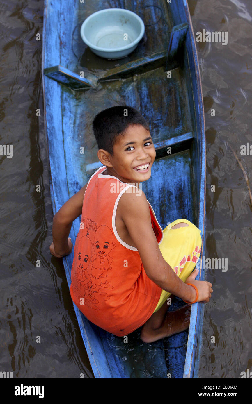 Boy standing in fishing boat hi-res stock photography and images - Alamy
