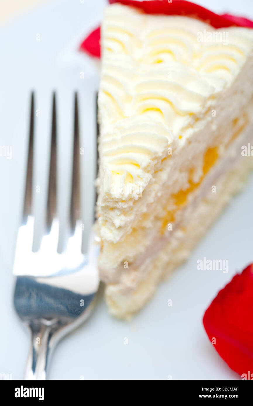 whipped cream mango cake with red rose petals Stock Photo Alamy