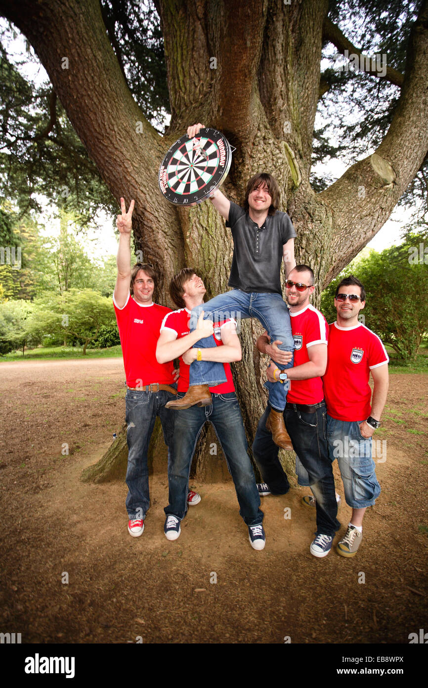 Embrace (English band) playing darts outside in Kemble