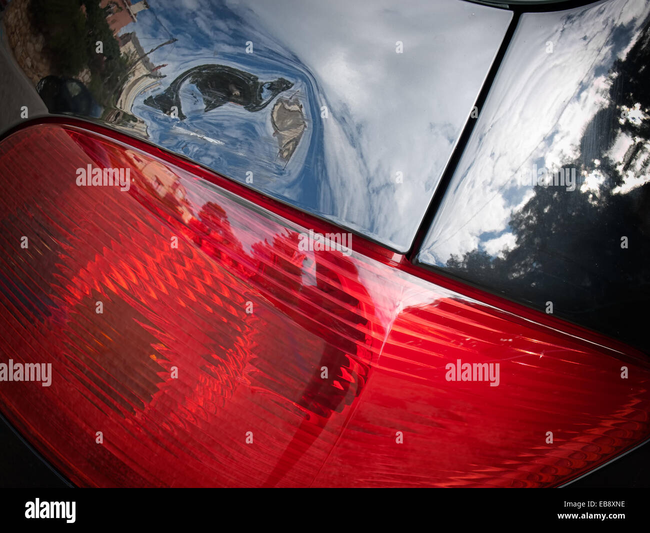 Dented tailgate of a car above the rear light. Stock Photo
