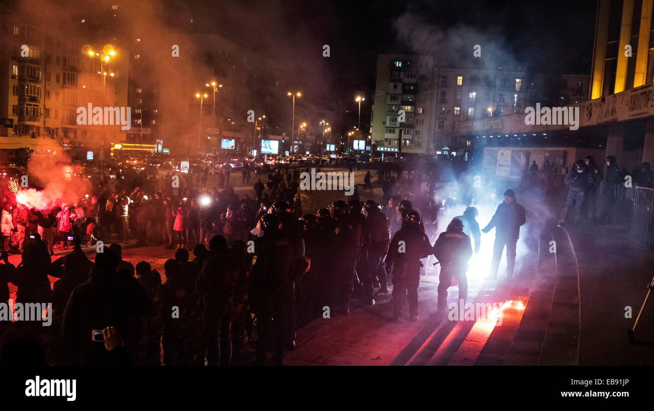 Kiev, Ukraine. 27th November, 2014. The second concert of Ani Lorak in Kiev accompanied by explosions of firecrackers, fireworks and smoke bombs.  Under patriotic slogans football ultras started throwing stones and firecrackers police, law enforcement agencies, in turn, until recently, held the cordon. However, when activists began to beat members of the MUP, the police went on the offensive. Football fans were quickly dispelled. Credit:  Igor Golovnov/Alamy Live News Stock Photo