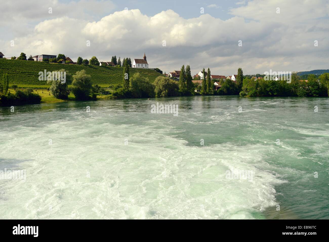 Rheinau catholic parish church seen from the dam of Rheinau hydro