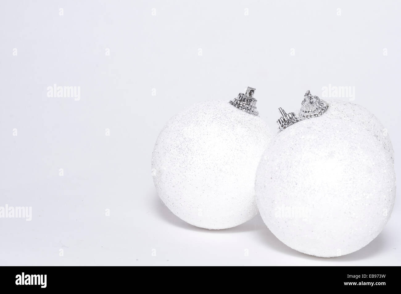 white Christmas backdrop with three balls Stock Photo
