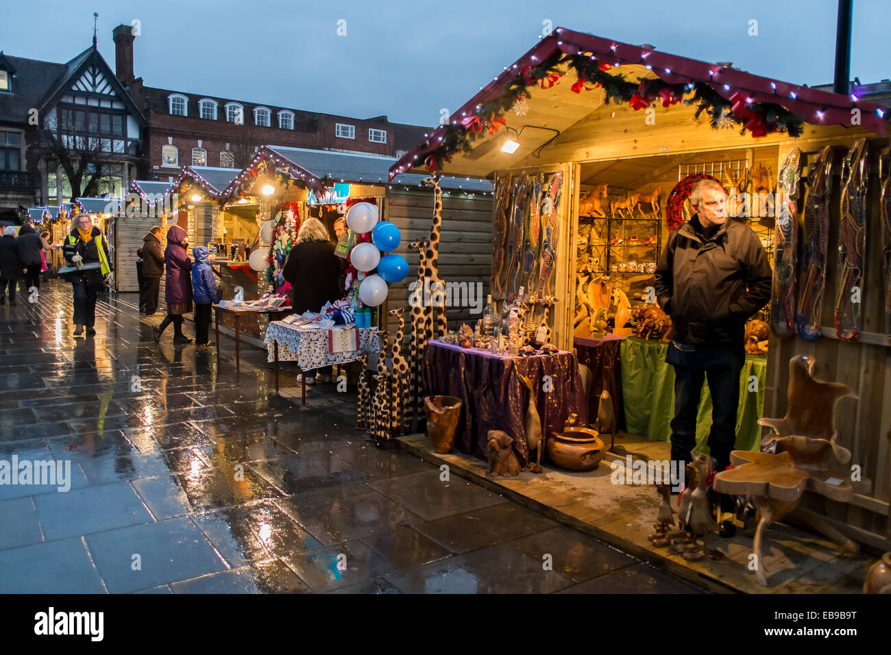 Salisbury 27th November 2014 Salisbury Christmas Market Openning night crowds gathered despite the weather Chalets selling Christmas goods and entertainment by local choirs . Rated by the Daily Telegraph in 2013 as one of the ‘Top 5 Christmas Markets in the UK. Credit:  Paul Chambers/Alamy Live News Stock Photo