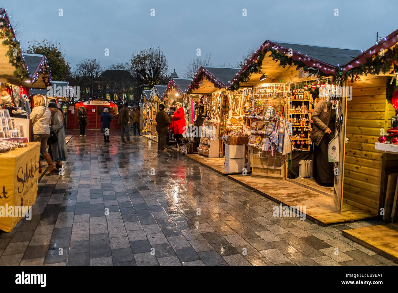 Salisbury 27th November 2014 Salisbury Christmas Market Openning night crowds gathered despite the weather Chalets selling Christmas goods and entertainment by local choirs . Rated by the Daily Telegraph in 2013 as one of the ‘Top 5 Christmas Markets in the UK. Credit:  Paul Chambers/Alamy Live News Stock Photo