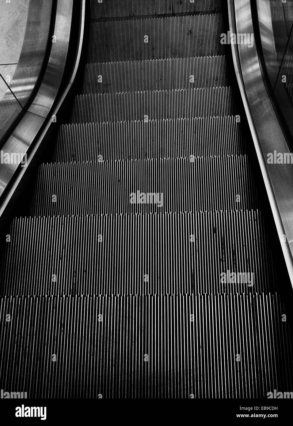 Black and white photograph of escalator . Stock Photo