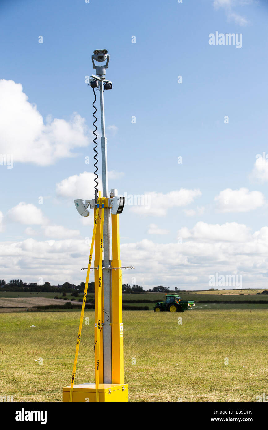 A protest against fracking at a farm site at Little Plumpton near Blackpool, Lancashire, UK, where the council for the first time in the UK, has granted planning permission for commercial fracking fro shale gas, by Cuadrilla. In the backgroud is a CCTV camera installed by Cuadrilla. Stock Photo