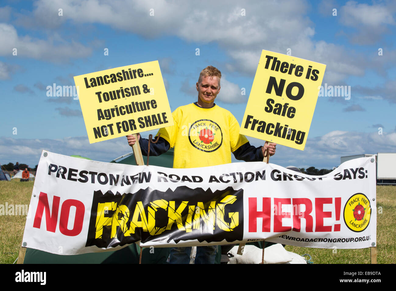 Protestors With A Protest Banner Against Fracking At A Farm Site