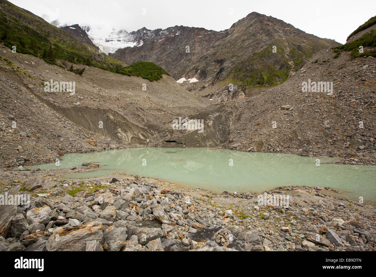 A meltwater lake at the snout of the rapidly retreating Bionnassay glacier coming off the Mont Blanc range. It has retreated over 200 metres in the last twenty years. Stock Photo