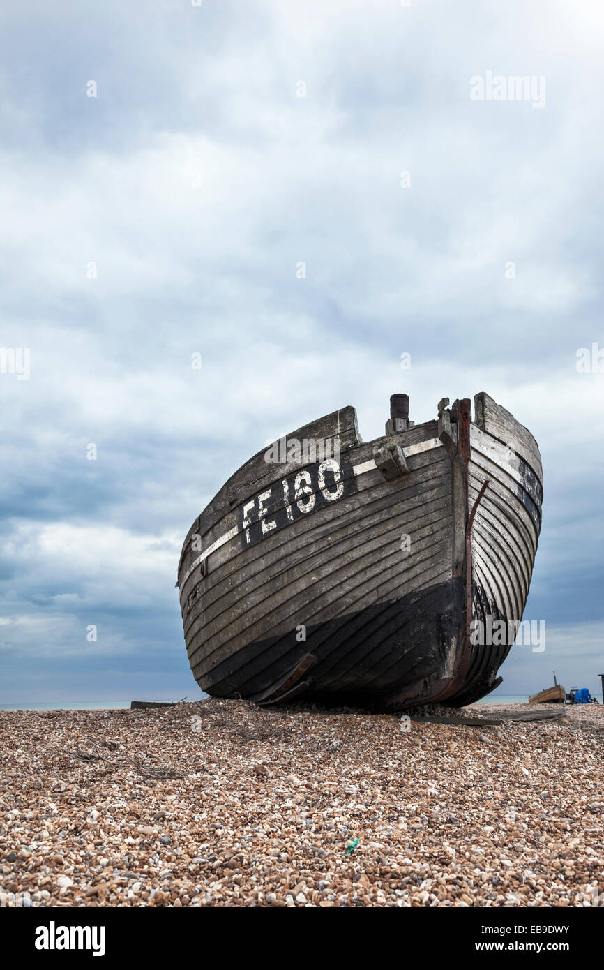 Abandoned fishing boat stranded on the beach in Dungeness, Kent ...
