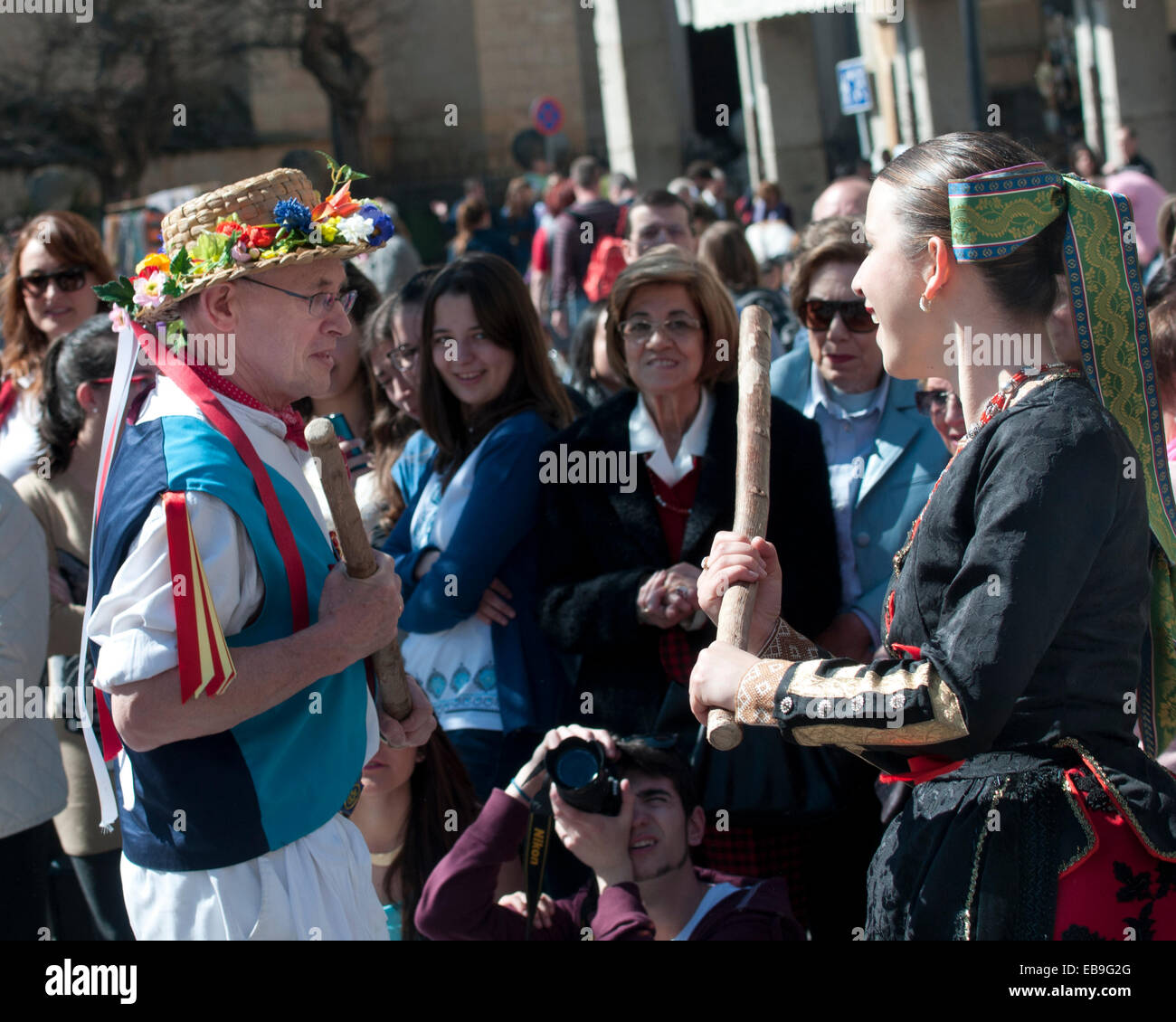 East Suffolk Morris Man dancing with a Spanish folk dancer in the ancient Roman city of Segovia Stock Photo