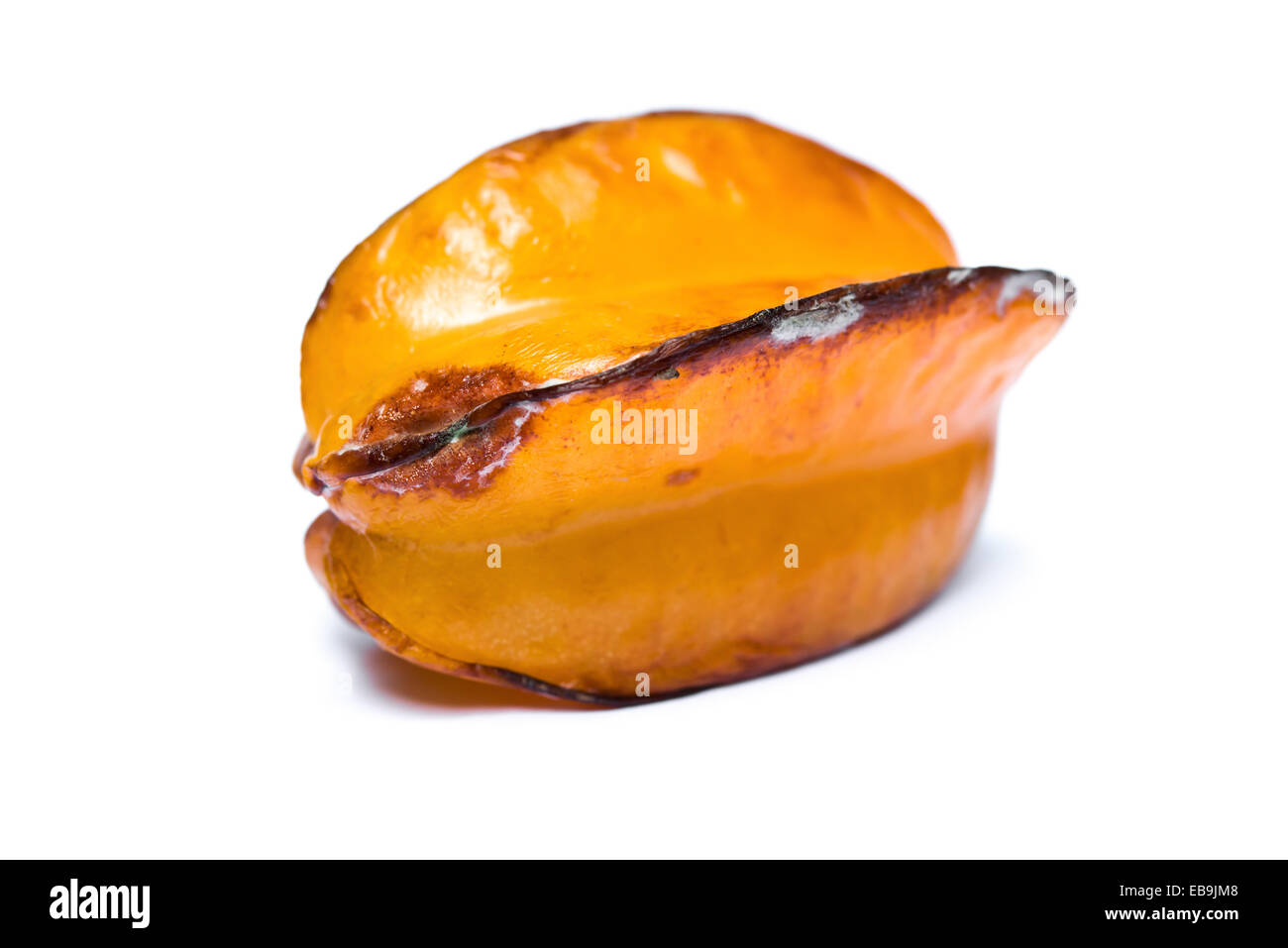 over-ripe starfruit on a white background Stock Photo