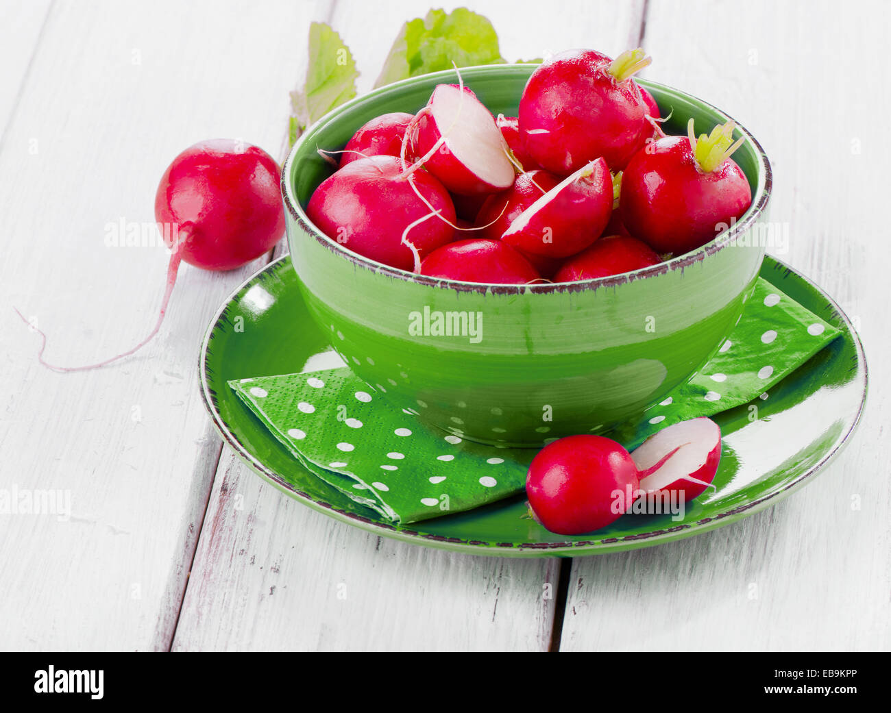 fresh radish in a blue plate. Selective focus Stock Photo