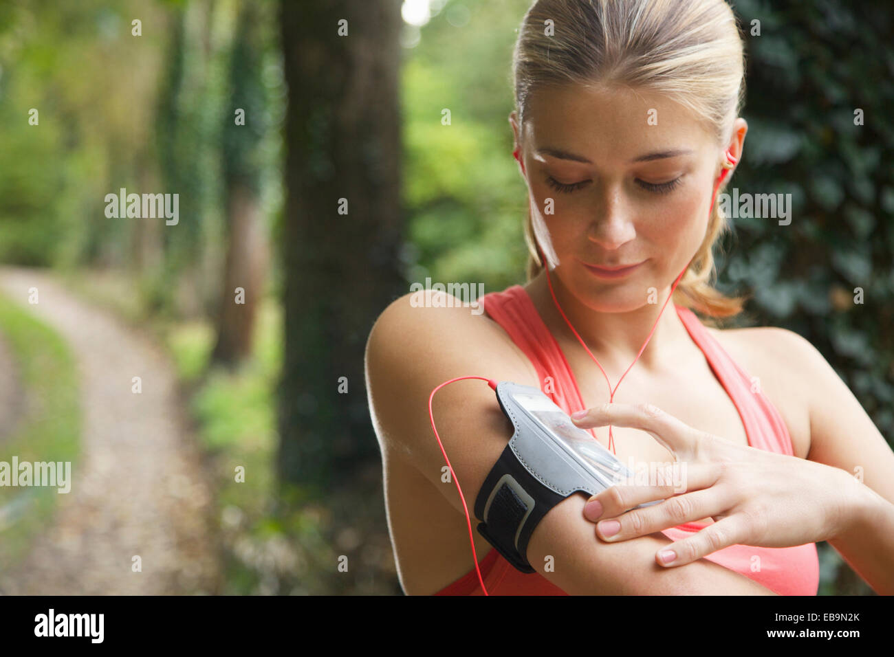 Woman Preparing Mp3 player for Work-out Stock Photo