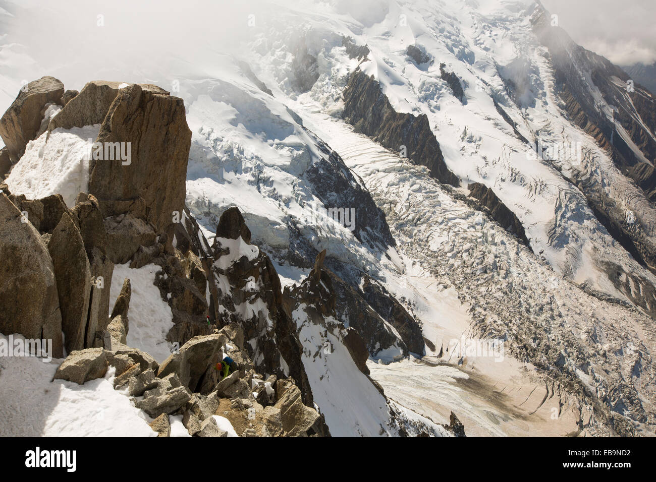 Mont Blanc from the Aiguille Du Midi above Chamonix, France, with climbers on the Cosmiques Arete. Stock Photo