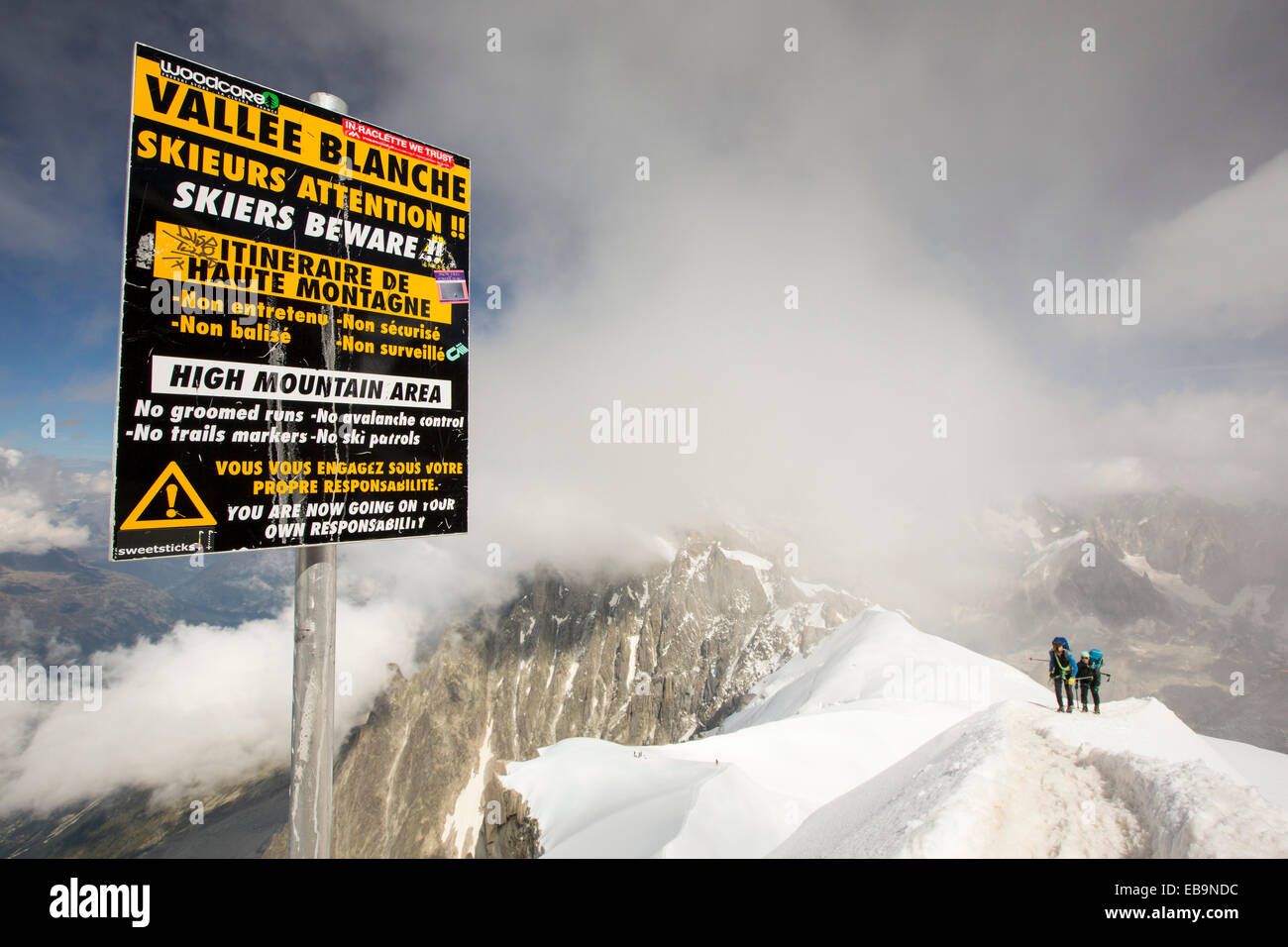 The Aiguille Du Midi above Chamonix, France, with climbers ascending the arete from the Vallee Blanche. Stock Photo