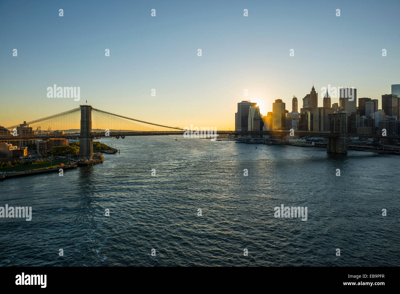 Skyline and Brooklyn Bridge, sunset, Downtown, Manhattan, New York, United States Stock Photo