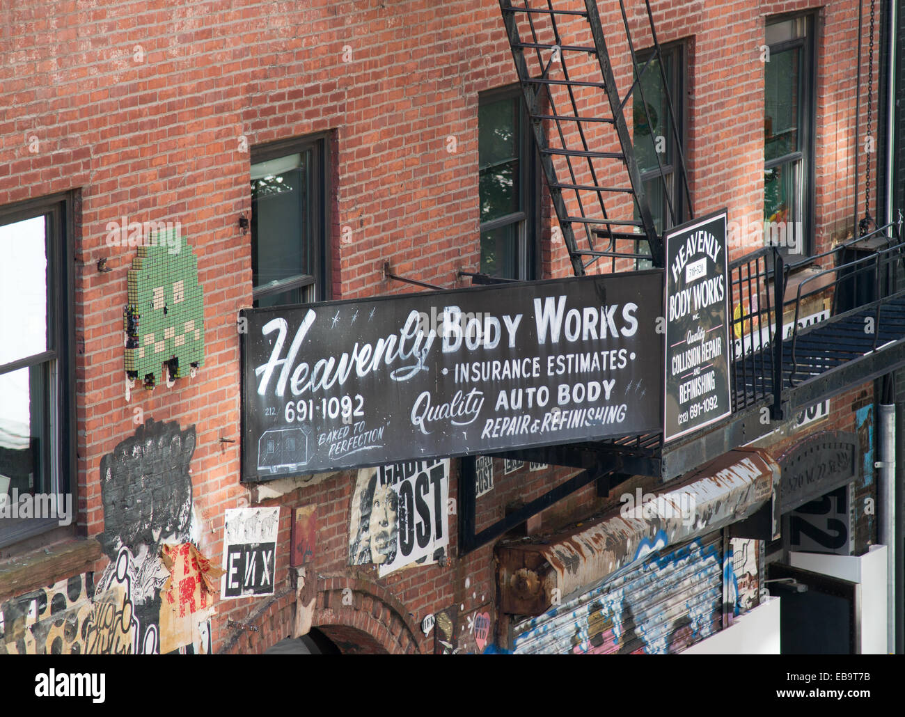 Sign above the Heavenly Body Works auto repair shop in Chelsea seen from the High Line, New York City, USA Stock Photo
