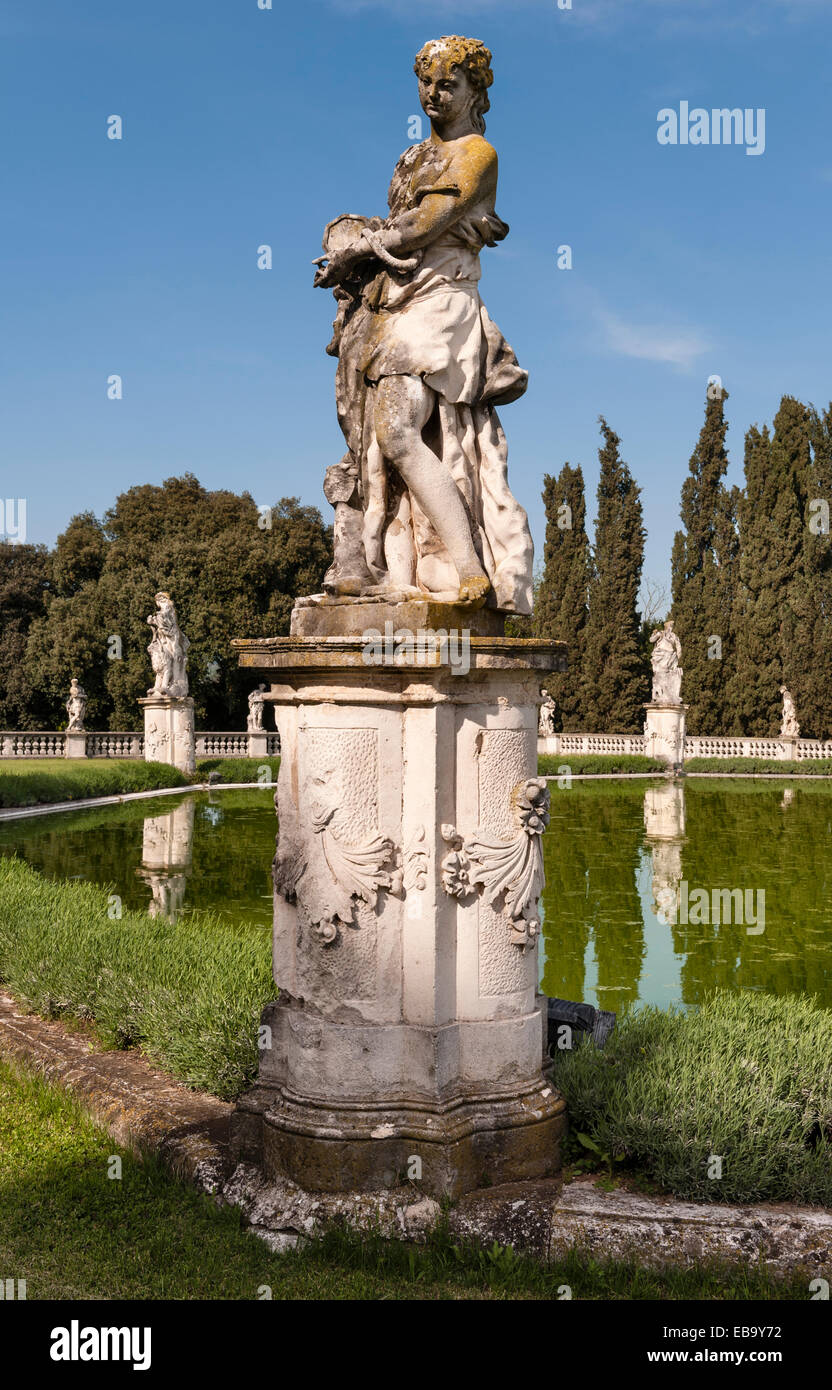 The romantic gardens of the early 18c Villa Trissino Marzotto, Vicenza, Italy. The pool in the lower garden, with a statue of Charity, by Marinali Stock Photo