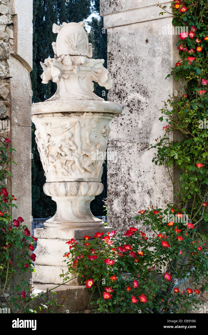 Villa Trissino Marzotto, Vicenza, Italy. A huge marble urn surrounded by climbing roses in the courtyard Stock Photo