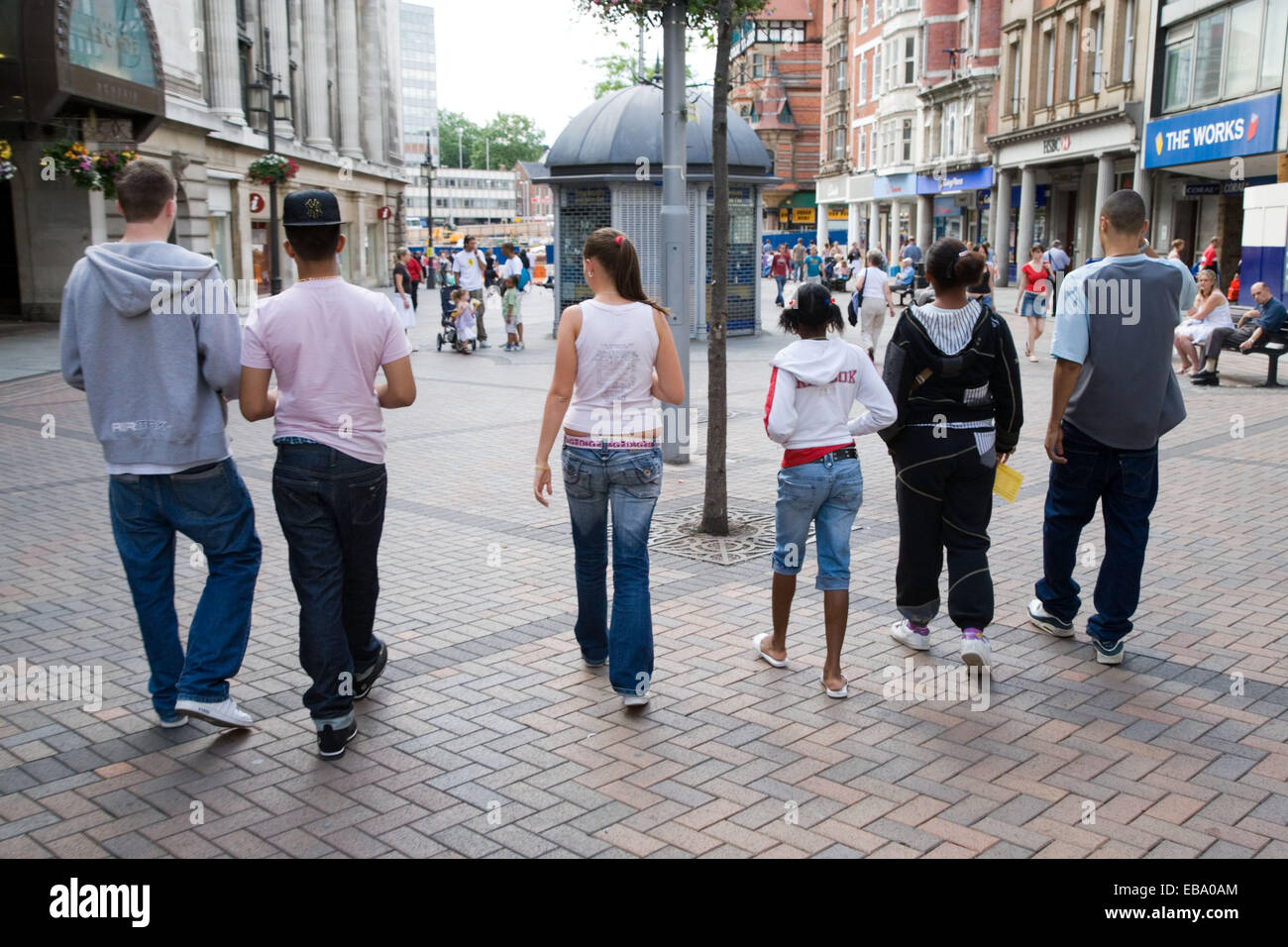 Group of teenagers walking down the street together, Stock Photo