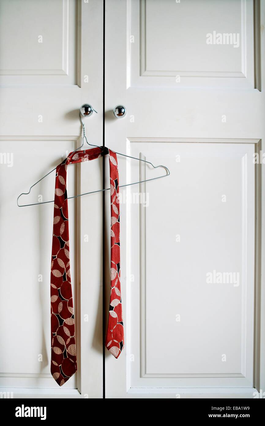 closet doors closed with a tie hung Stock Photo Alamy