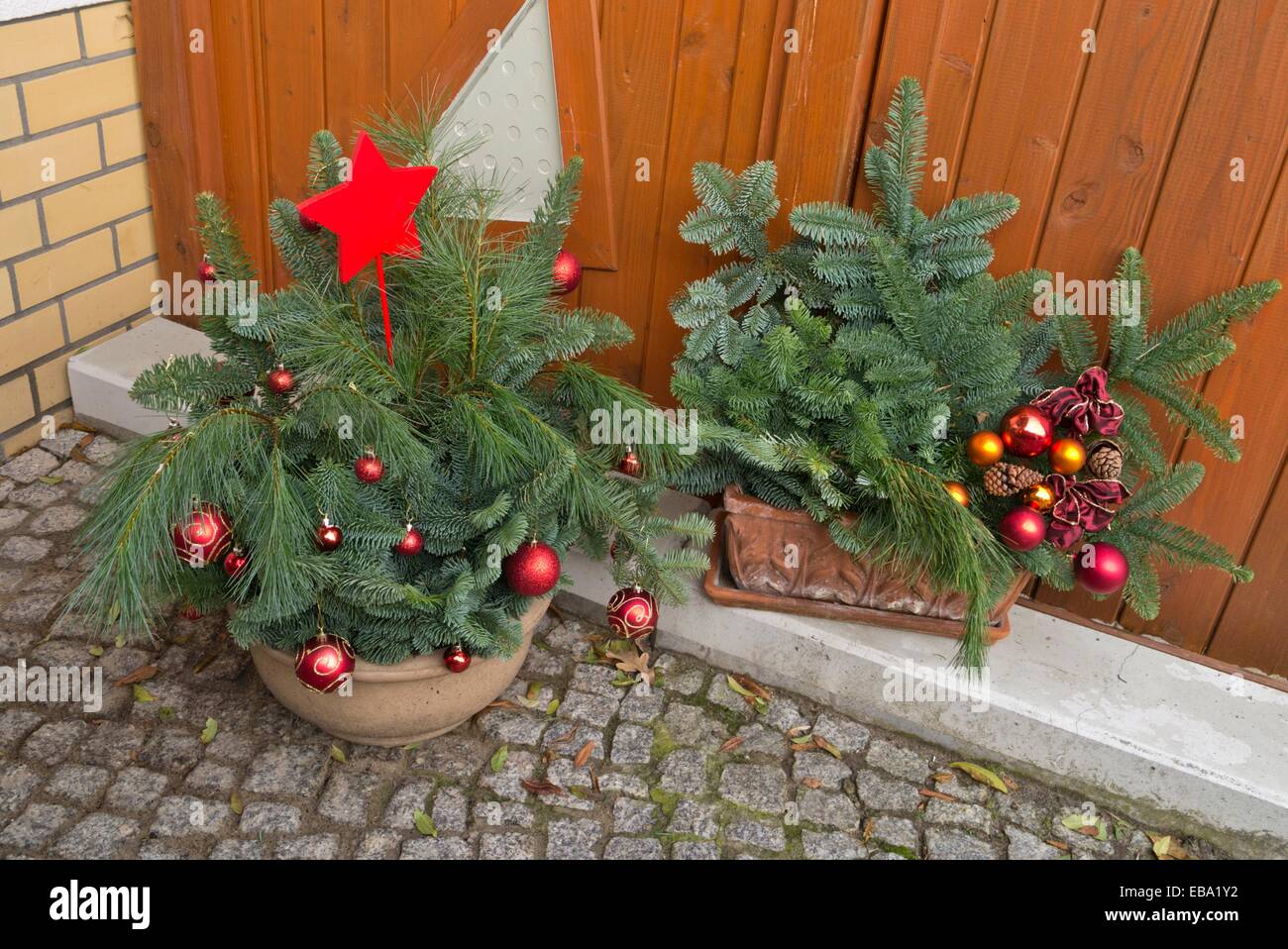 Christmas arrangement with twigs and Christmas tree baubles Stock Photo