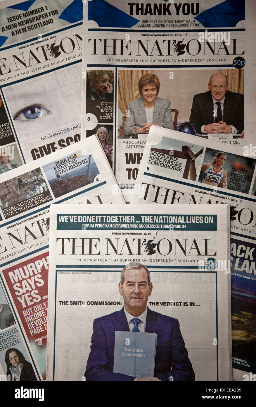 Scotland, UK. 28th Nov. 2014. The cover of the fifth edition of The National newspaper declares 'WE'VE DONE IT...THE NATIONAL LIVES ON' The paper was launched in little more than three weeks from idea to reality. First edition sold out, 100,000 were printed the second day and sales stayed at high level, bolstered by more than 11,000 digital subscriptions. The Scottish newspaper that supports an independent Scotland was launched by Sunday Herald editor Richard Walker for publishers Newsquest. Stock Photo