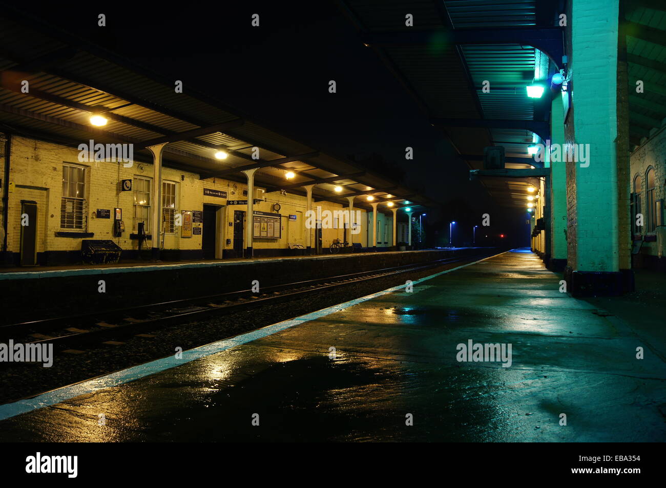 Deserted small town train station at night Stock Photo