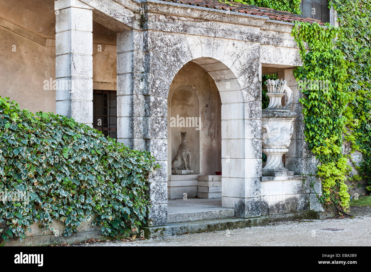 Villa Trissino Marzotto, Vicenza, Italy. The exterior of the original plain 15c building, later decorated with huge stone urns and animal statues Stock Photo