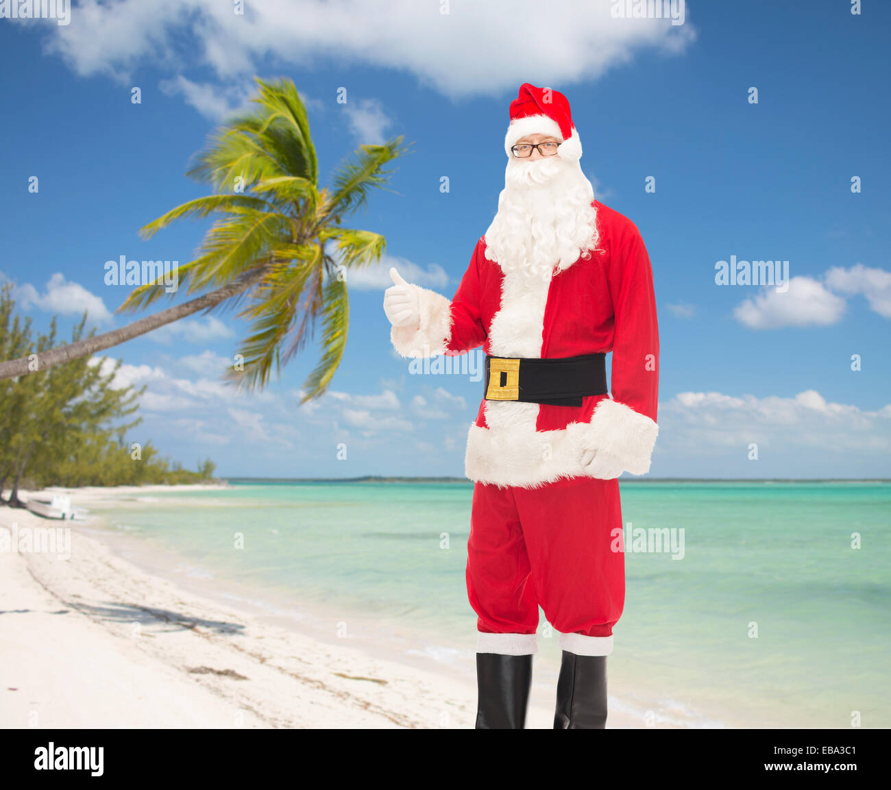 man in costume of santa claus showing thumbs up Stock Photo - Alamy