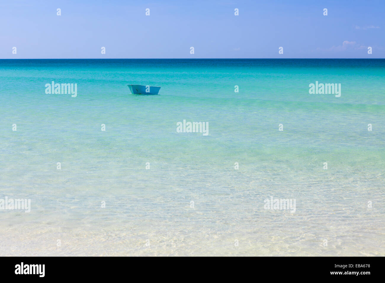 Fisher boat and clear turquoise water at daytime Stock Photo - Alamy