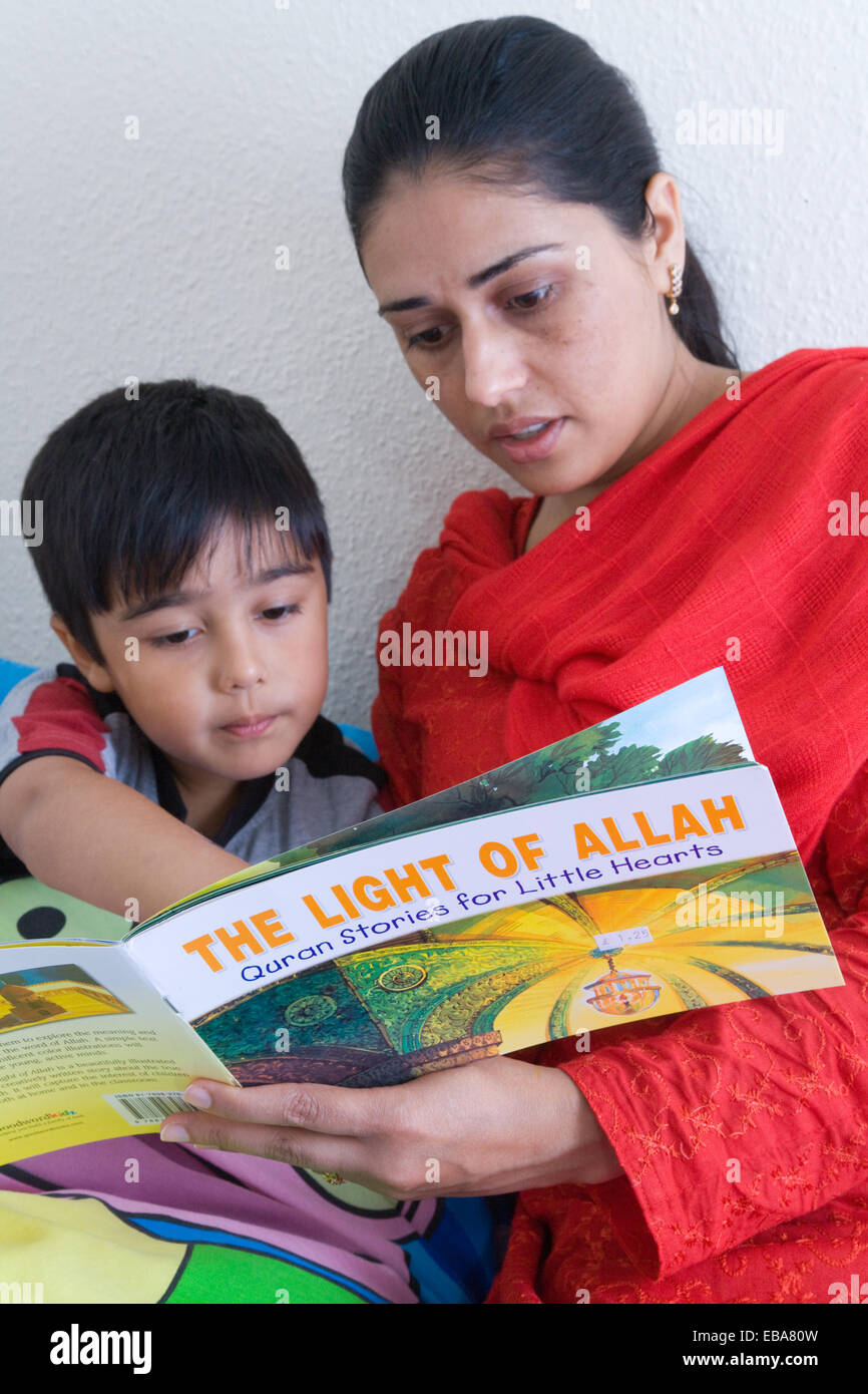 Mother reading a book to her son, Stock Photo