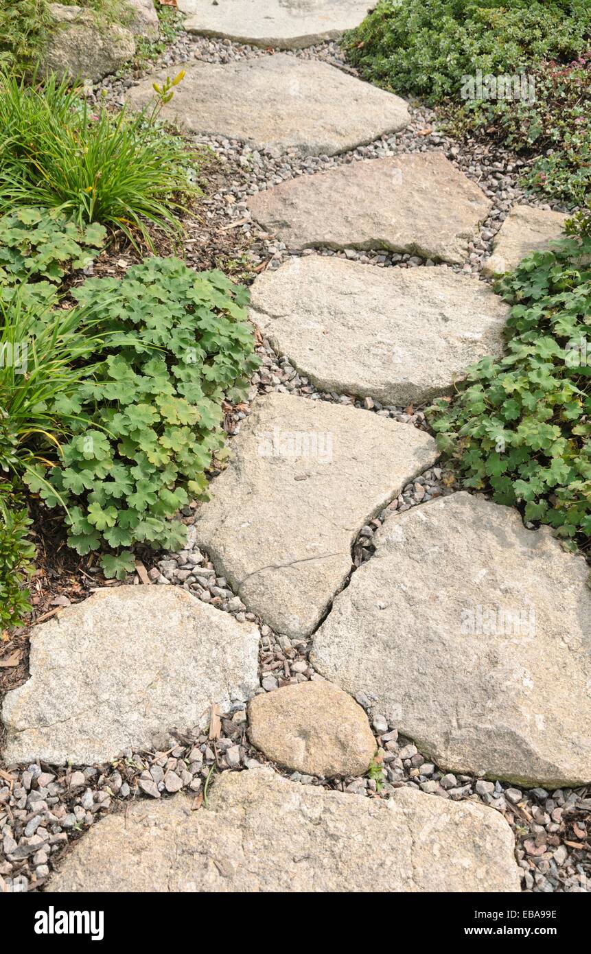 Garden pathway with stone slabs Stock Photo