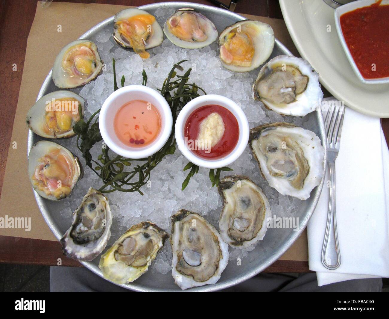 Happy hour menu top neck clams and oysters at City Crab restaurant