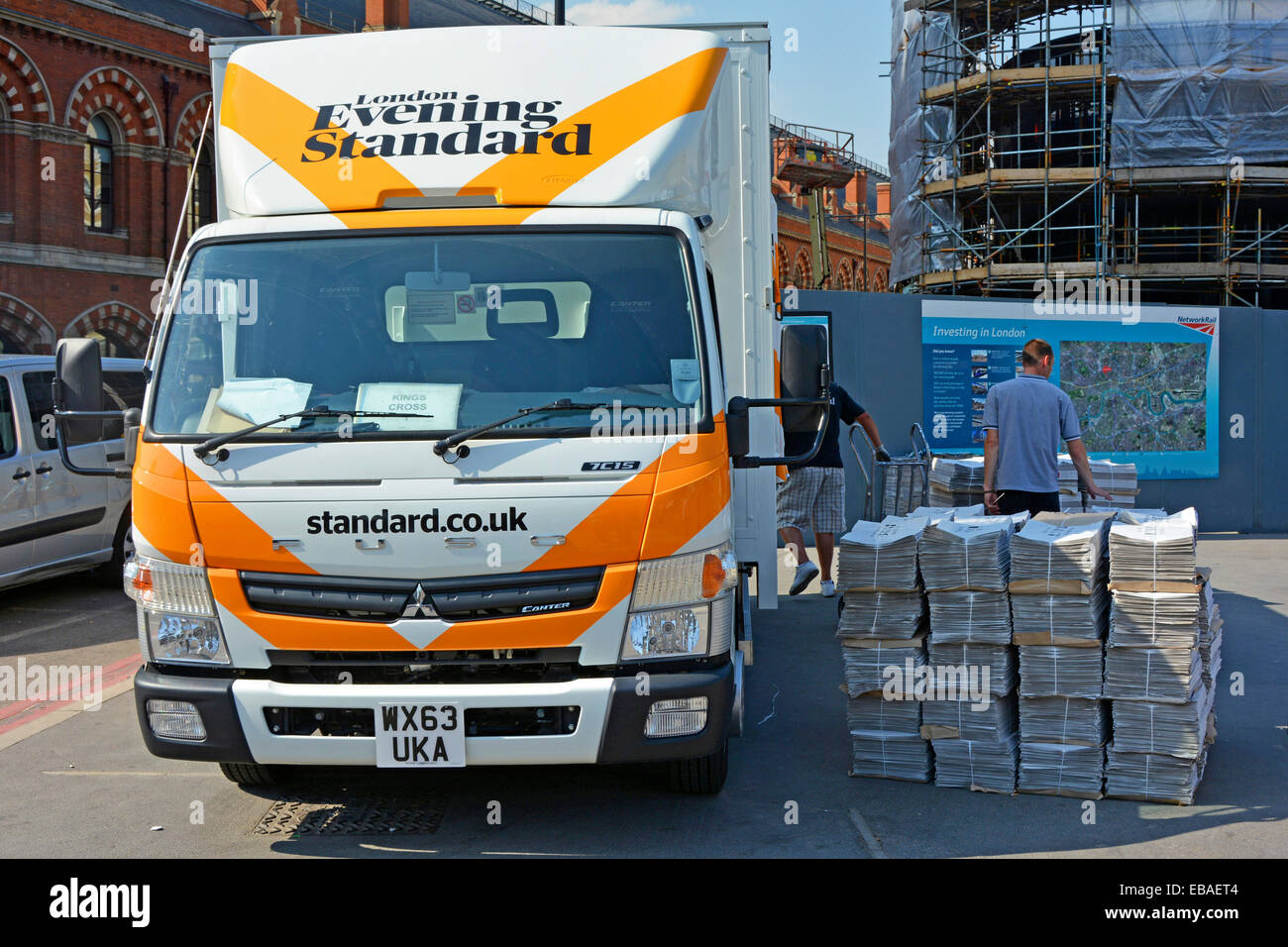 London Evening Standard lorry truck delivering free newspaper unloaded onto pavement outside Liverpool Street train station City of London England UK Stock Photo
