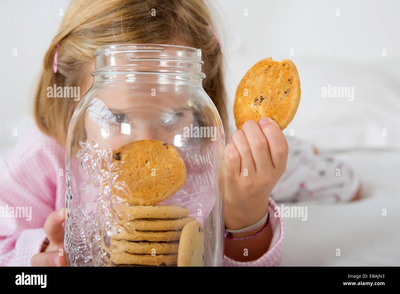 Girl with her hand in the cookie jar Stock Photo Alamy