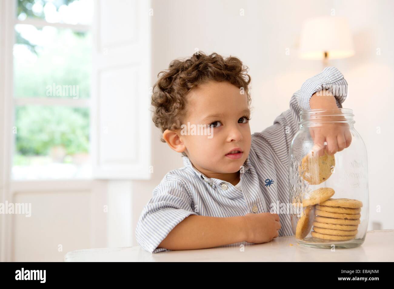 Boy in cookie jar hires stock photography and images Alamy