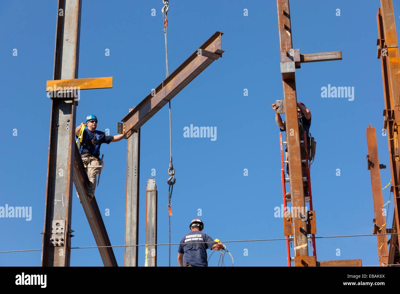 Steel workers assemble building framework girders, Boston, MA Stock